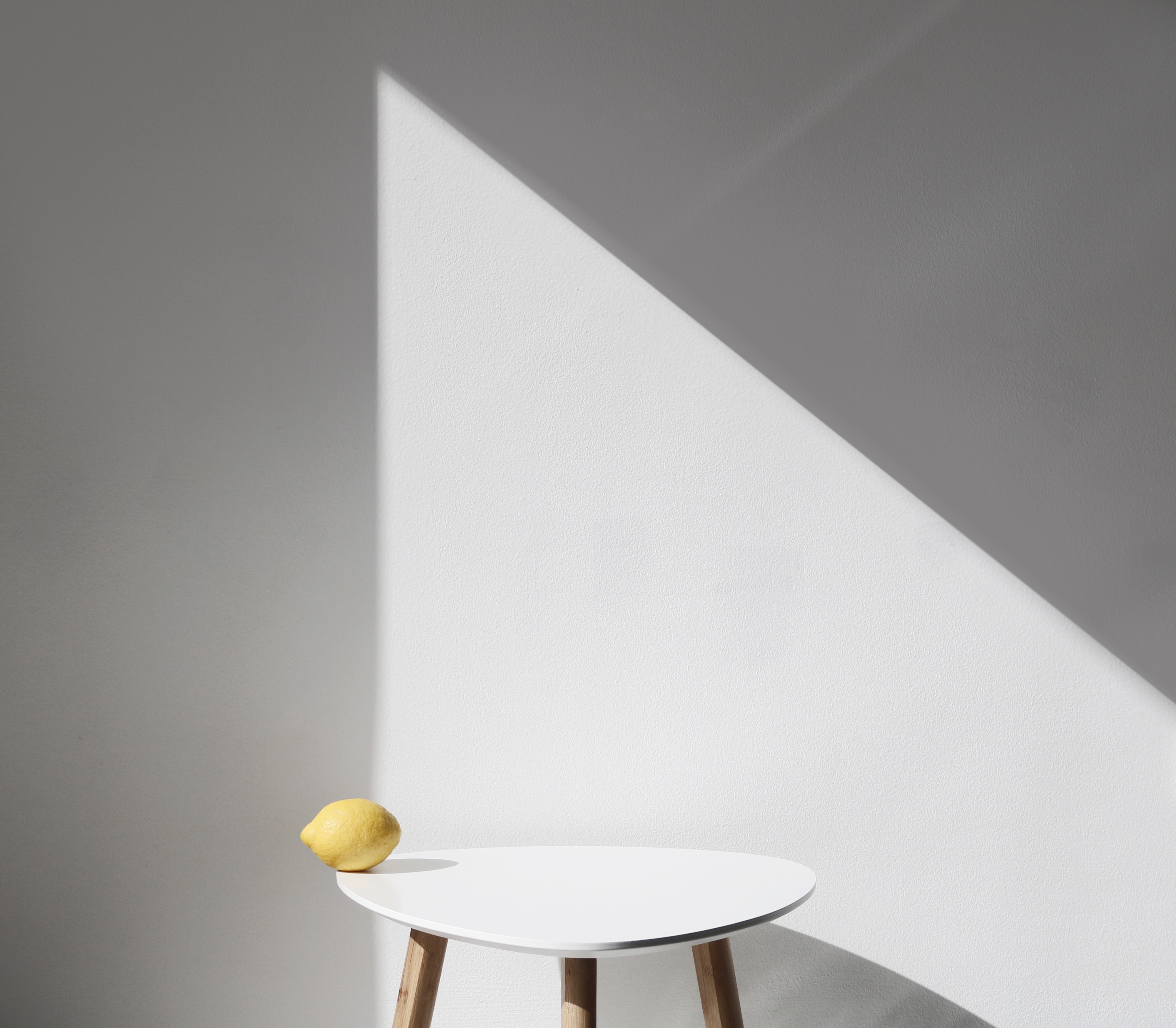 lemon table wall shadow minimal