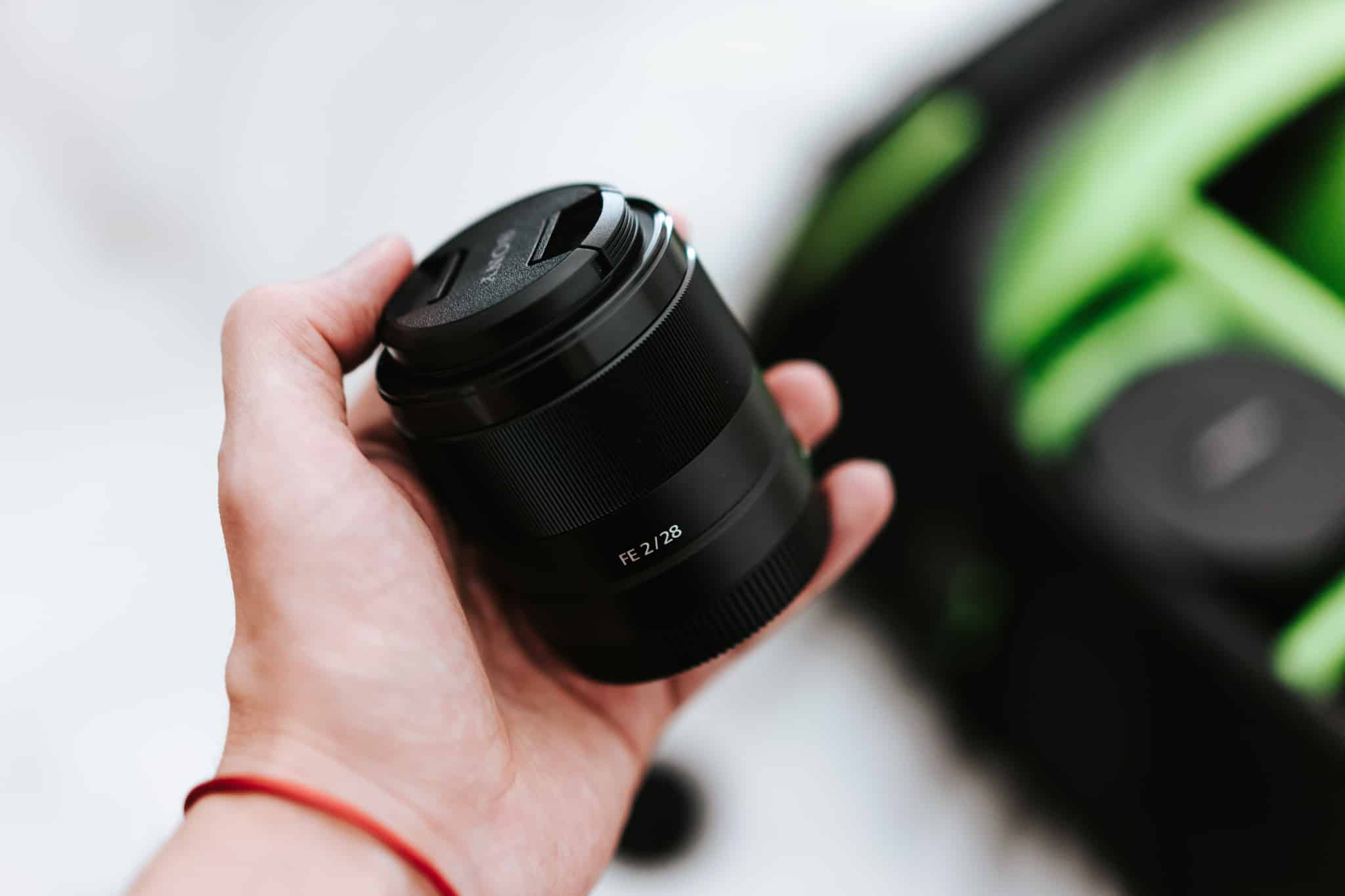 sony 28mm f2 lens and a camera bag picjumbo com